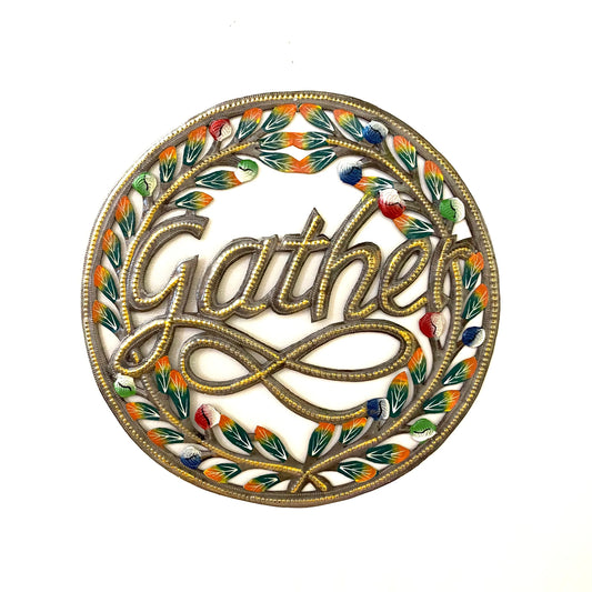 Measuring 16 inches in diameter, this circular wall art features the word "Gather" chiseled in elegant lettering at its center, surrounded by delicate leaves in vivid colors. The golden hue of the piece adds an air of elegance and sophistication, while the use of recycled materials ensures that it's environmentally conscious.