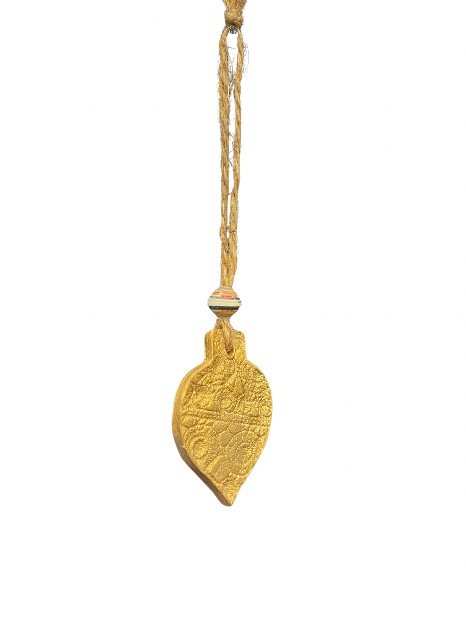 Haitian craftsmanship meets holiday décor with our Gold Lace Ceramic Bulb Ornament. This unique ornament is crafted by hand from locally sourced clay and hand-painted with a gold lace finish at our artisan center. Measuring approximately 5", it adds a special touch to any tree or holiday collection. Shop now and add some Haitian charm to your festive celebrations.