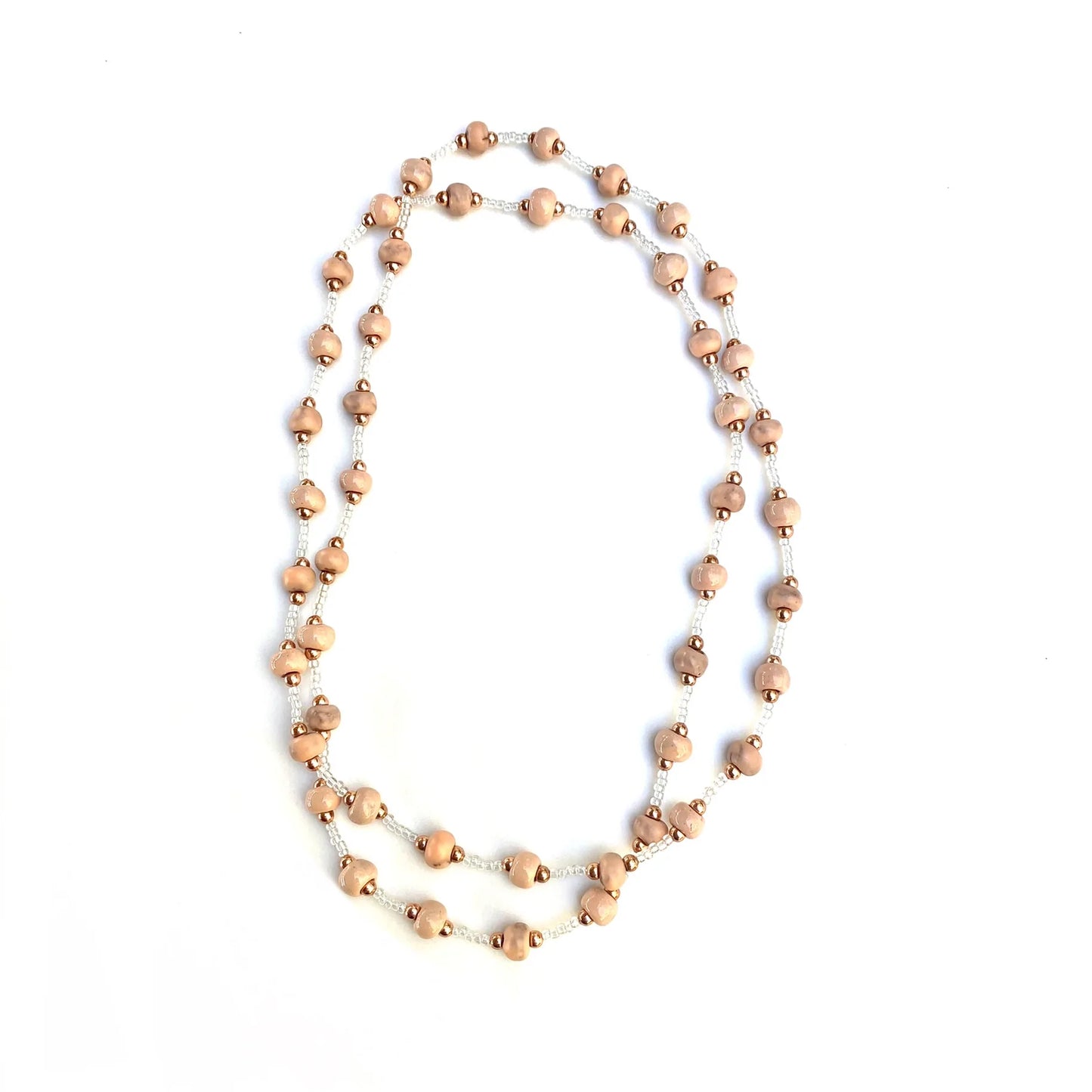 A sweet classic piece with subtle ceramic beads in loving memory of Marise and her baby. The ceramic beads represent Marise and the work she did making beads. The rose gold beads represent her baby who went to Heaven with her. The white seed beads represent the five children she left behind. 